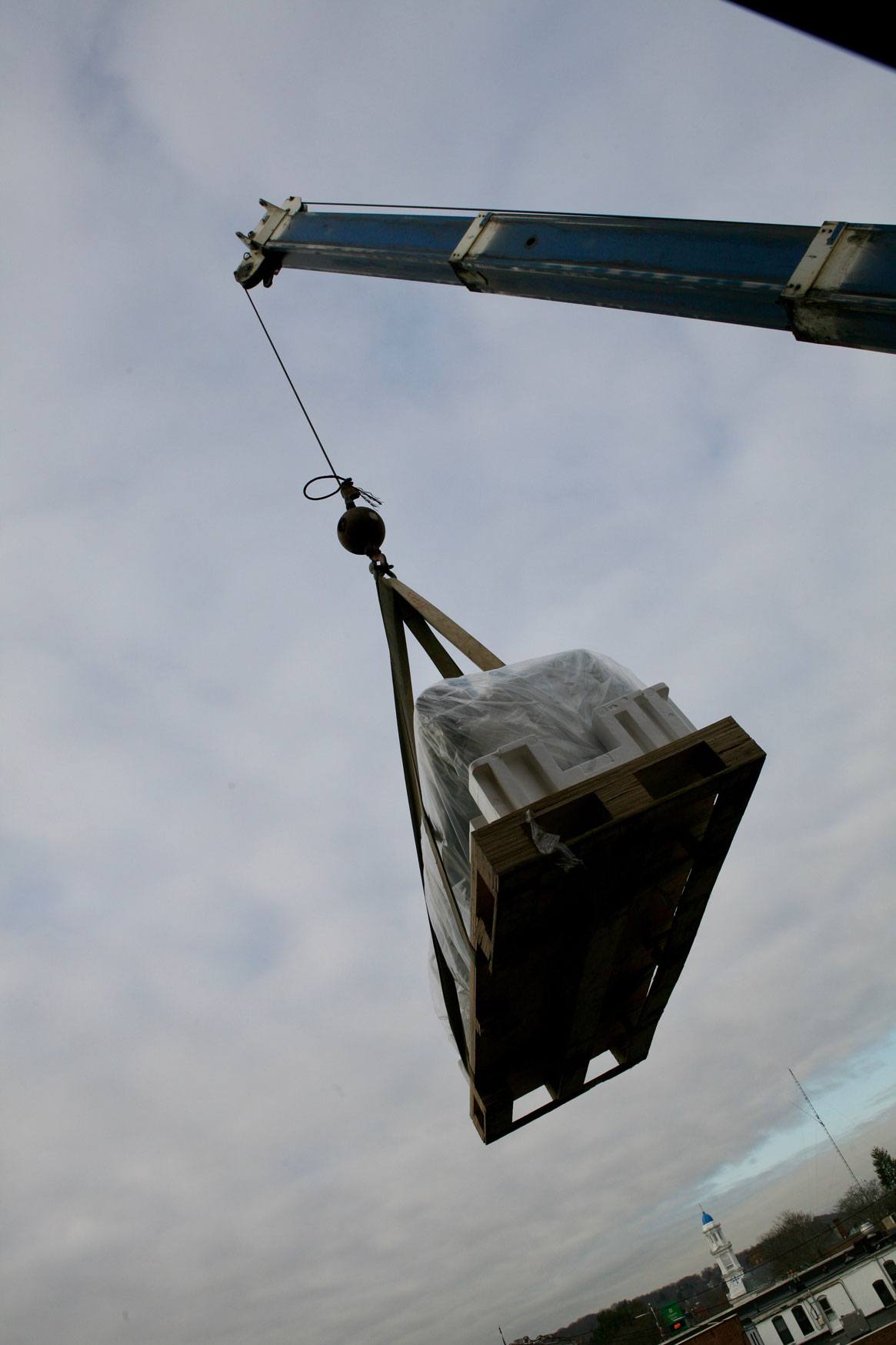 Epson P20000 printer hoisted in the sky by a crane