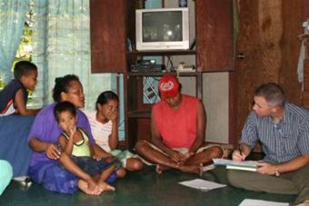Air Force photo - Mark Duffy interviews family on Yap Island investigating Zika outbreak